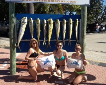 People in front of the sailfish marina sign